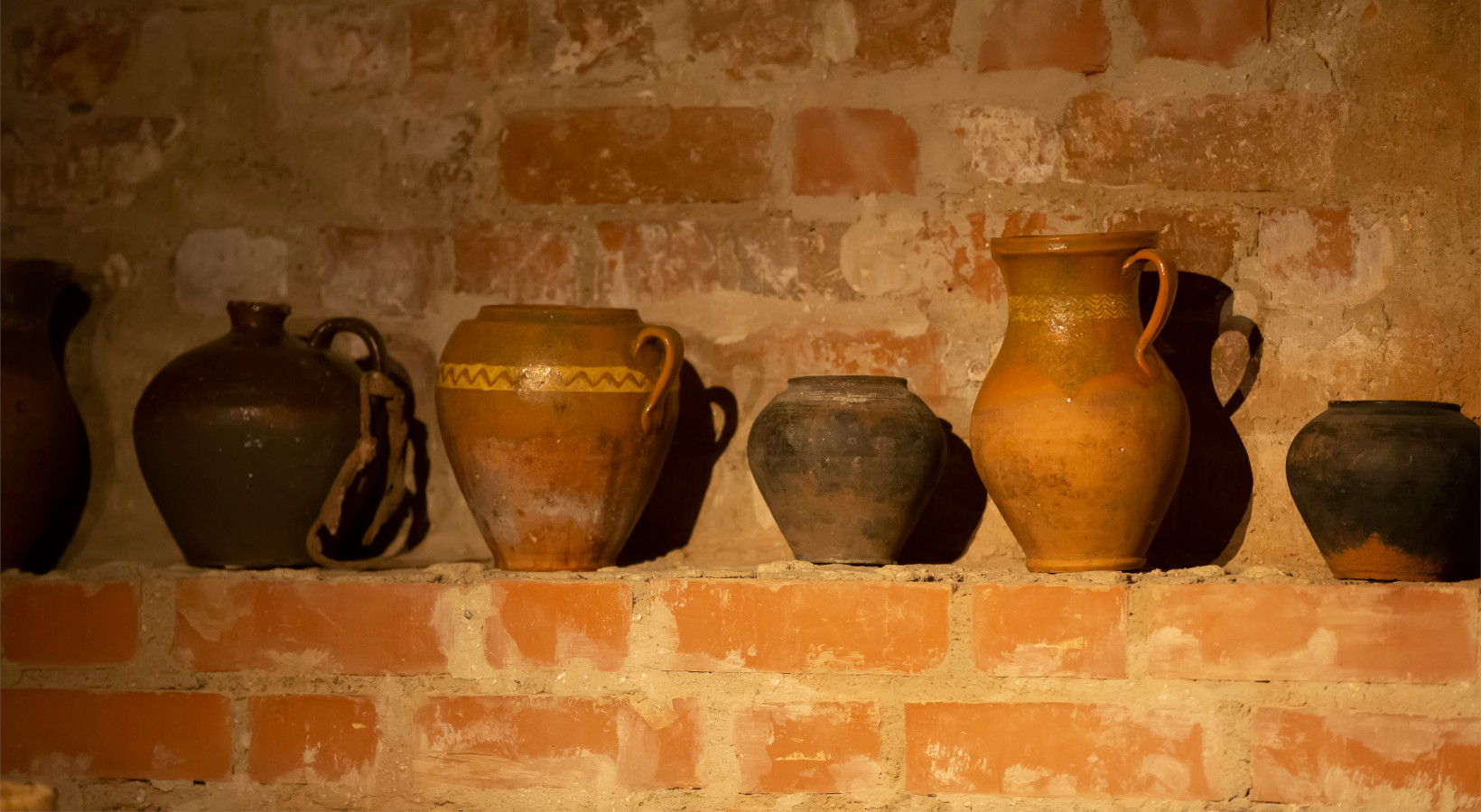 antique-wine-pitchers-in-a-row